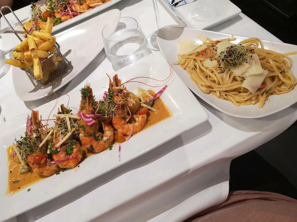 Noix de Saint Jacques Et Gambas Flambés